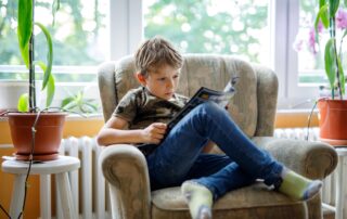 middle school student reading a magazine