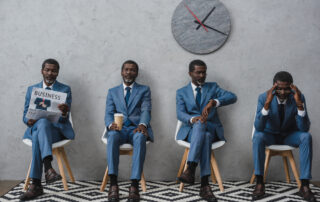 Businessmen waiting at at a doctor's office waiting room