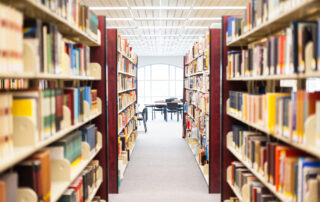 library setting with books, magazines and reading material