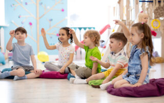 Preschool children reading magazines